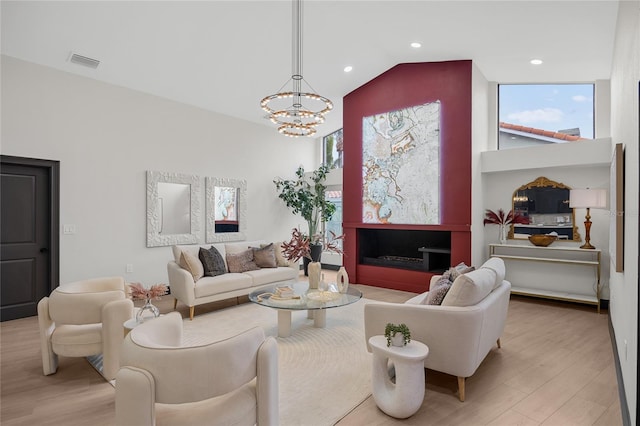 5809 Cruiser Way, Tampa, FL 33615 - living area with a chandelier, light wood-style flooring, lofted ceiling, and recessed lighting