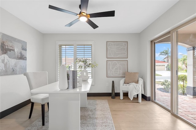 5809 Cruiser Way, Tampa, FL 33615 - home office with light wood finished floors and ceiling fan