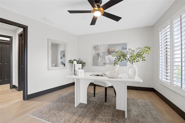 5809 Cruiser Way, Tampa, FL 33615 - office area featuring light wood finished floors, healthy amount of natural light, and a ceiling fan
