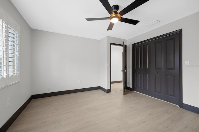 5809 Cruiser Way, Tampa, FL 33615 - unfurnished bedroom featuring light wood-type flooring, a closet, and ceiling fan