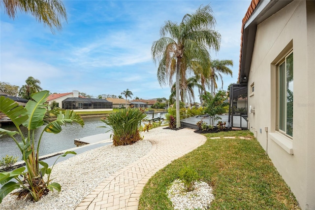 5809 Cruiser Way, Tampa, FL 33615 - surrounding community with a water view and a lawn
