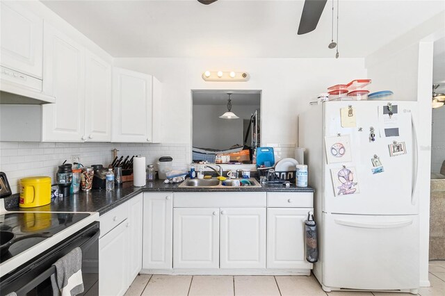 27284 Sunnybrook Rd, Punta Gorda, FL 33983 - kitchen featuring white cabinets, sink, white fridge, and electric range oven