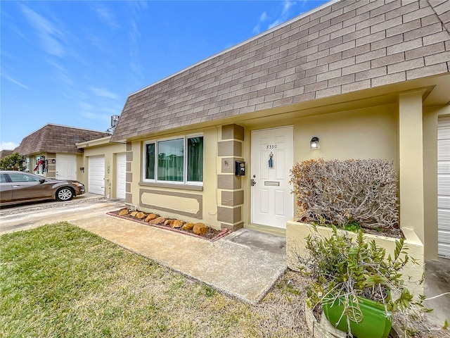 doorway to property featuring a garage