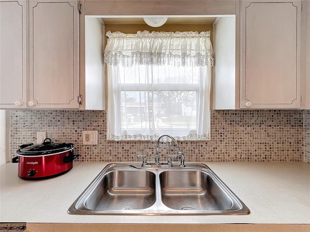 kitchen with sink and decorative backsplash