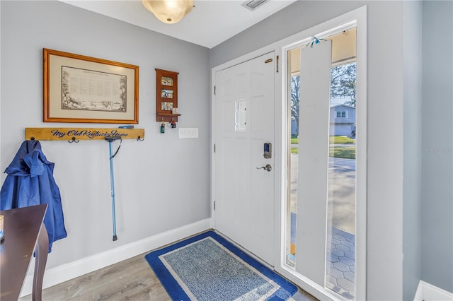 foyer entrance with hardwood / wood-style floors