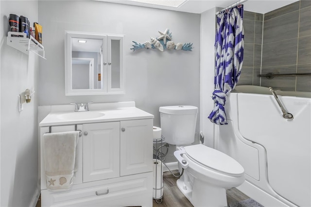 bathroom featuring vanity, hardwood / wood-style floors, and toilet