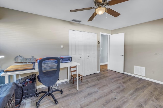 office area with ceiling fan and light wood-type flooring