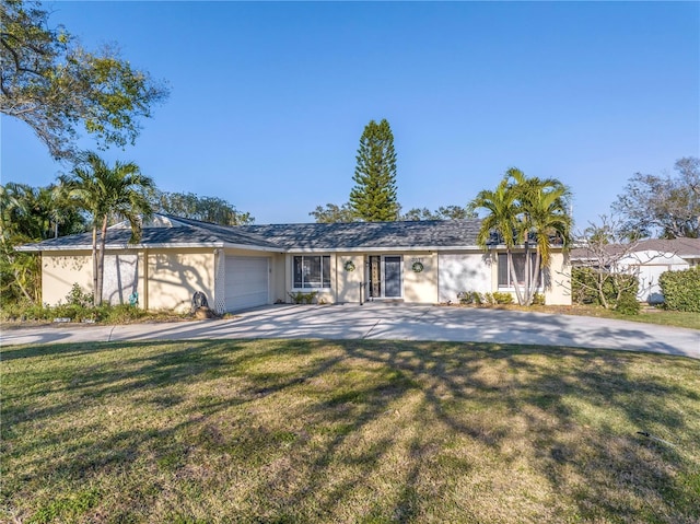 ranch-style house with a garage and a front yard