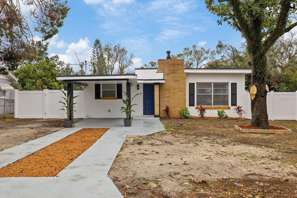 view of front of home featuring a carport