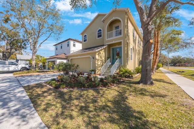 mediterranean / spanish house featuring a garage and a front yard