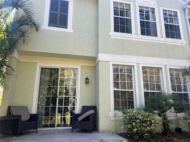 doorway to property with a patio