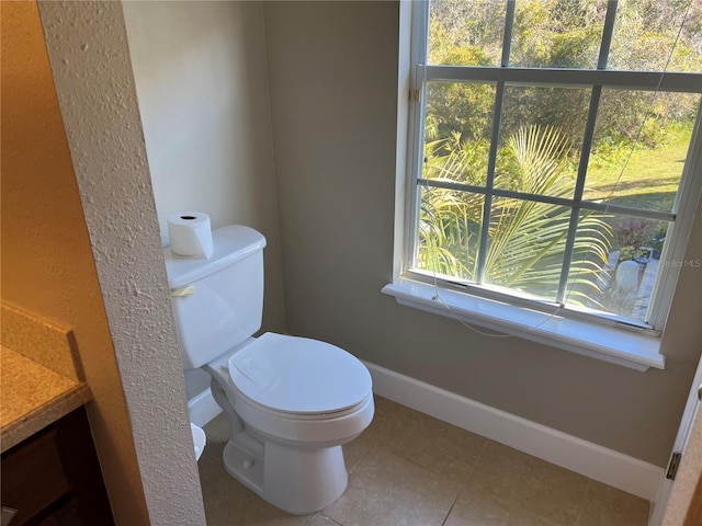 bathroom with vanity, tile patterned floors, and toilet