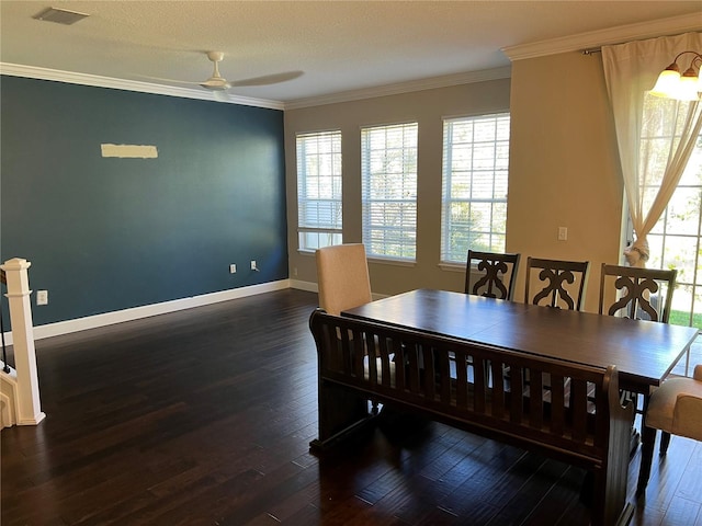 dining area with crown molding, ceiling fan, and dark hardwood / wood-style flooring