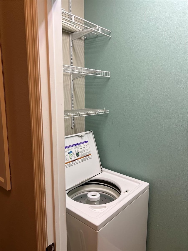 clothes washing area featuring washer / clothes dryer