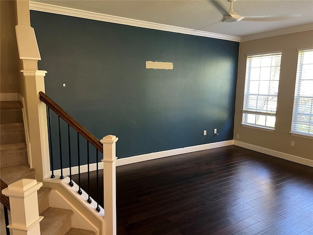 staircase with crown molding, ceiling fan, a textured ceiling, and hardwood / wood-style flooring