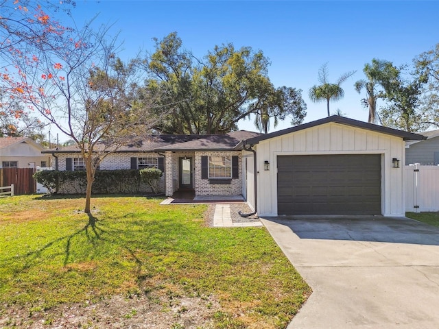 ranch-style home with a garage and a front lawn