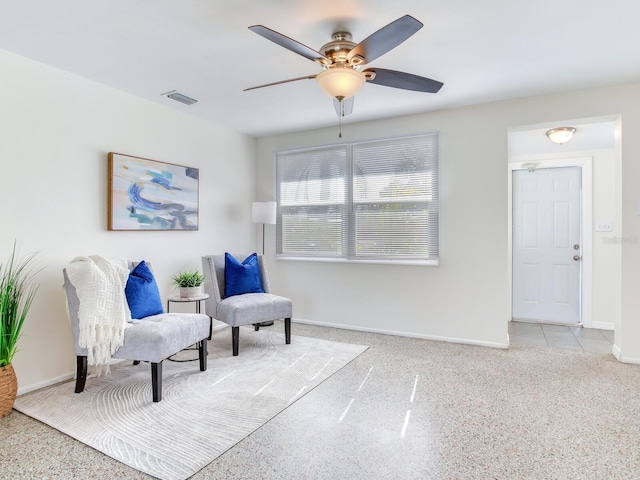 sitting room featuring ceiling fan