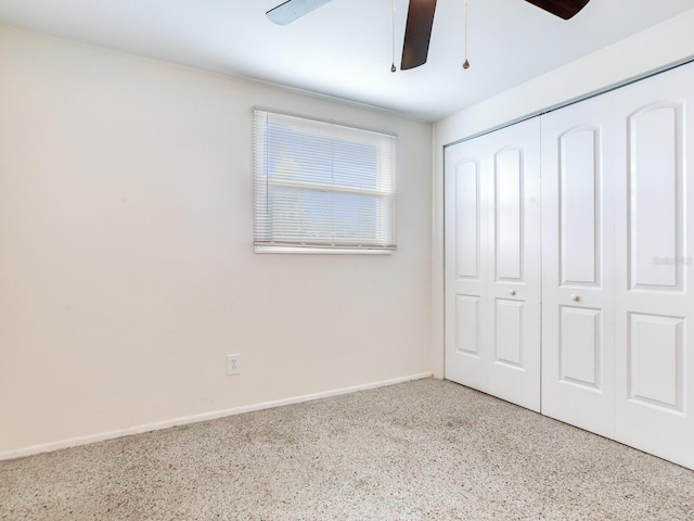 unfurnished bedroom with a closet and ceiling fan