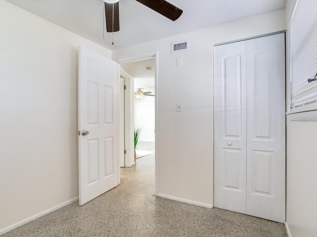 unfurnished bedroom with a closet and ceiling fan