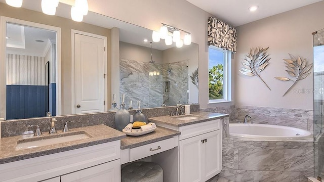 bathroom with vanity and separate shower and tub