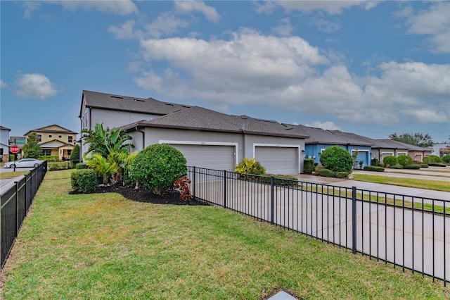 exterior space with a garage and a yard