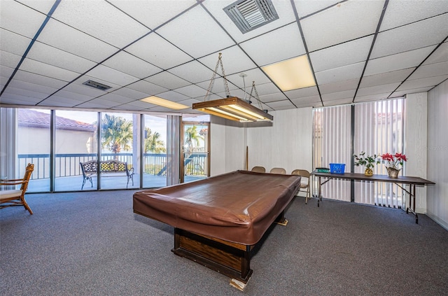 rec room with pool table, plenty of natural light, carpet, and a drop ceiling