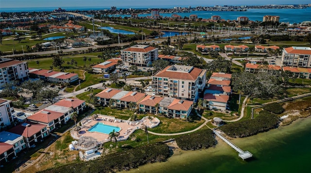 birds eye view of property with a water view