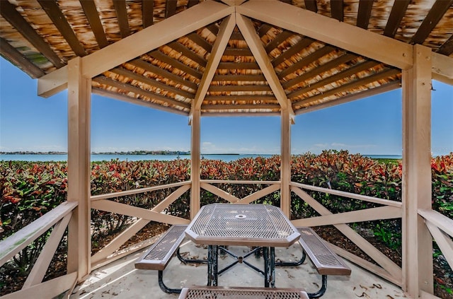 view of patio / terrace featuring a water view and a gazebo