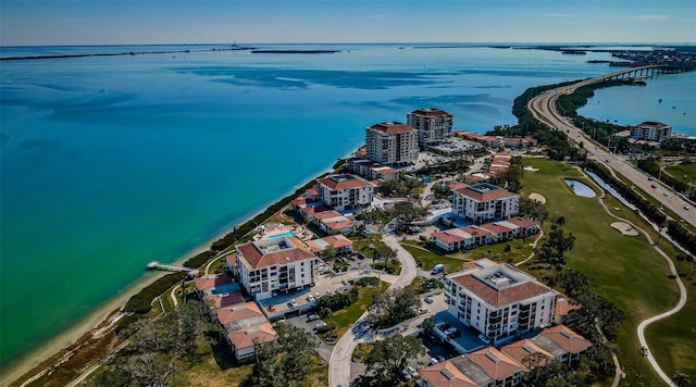 birds eye view of property with a view of city and a water view