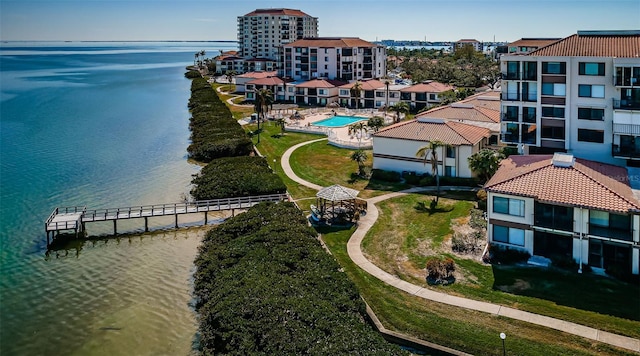 birds eye view of property with a water view