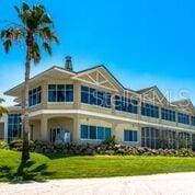 view of front of property with a garage and a front lawn