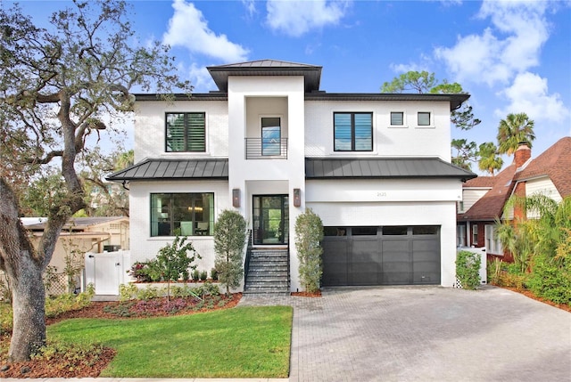 view of front of house with a garage and a front yard