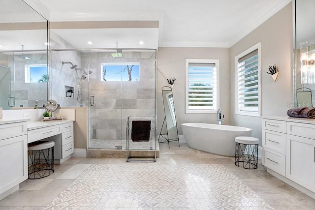 bathroom with vanity, a wealth of natural light, and independent shower and bath