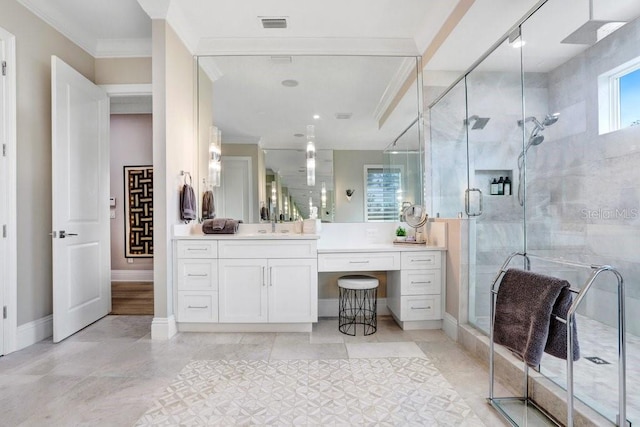 bathroom featuring vanity, ornamental molding, an enclosed shower, and tile patterned floors