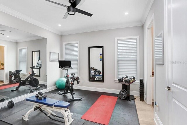 workout room featuring ornamental molding and ceiling fan