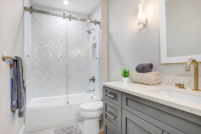 full bathroom featuring vanity, toilet, and bath / shower combo with glass door