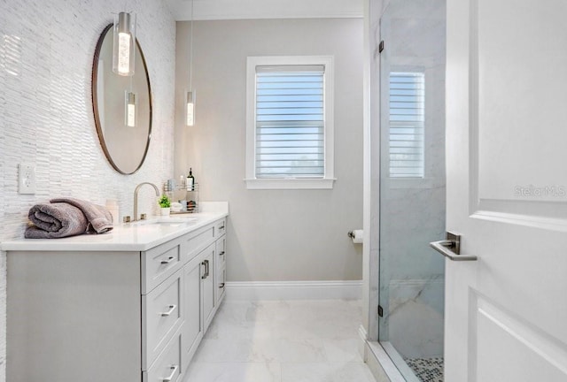 bathroom featuring vanity, a wealth of natural light, and an enclosed shower