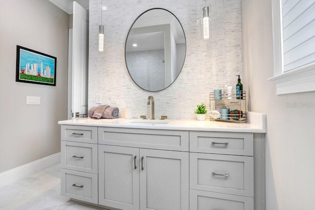 bathroom with tasteful backsplash and vanity