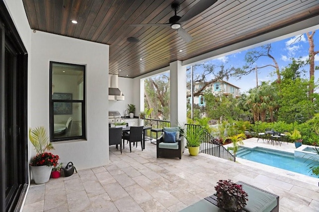 view of patio with grilling area and ceiling fan