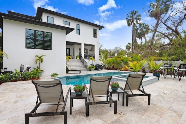 rear view of property featuring a patio area