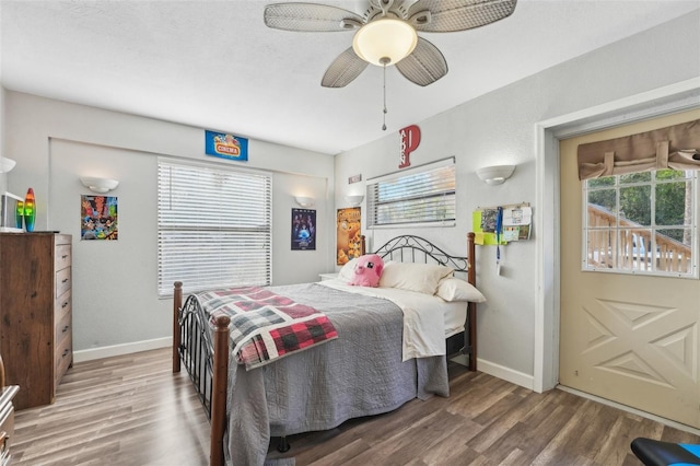 bedroom featuring hardwood / wood-style floors and ceiling fan