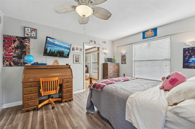 bedroom featuring hardwood / wood-style flooring and ceiling fan