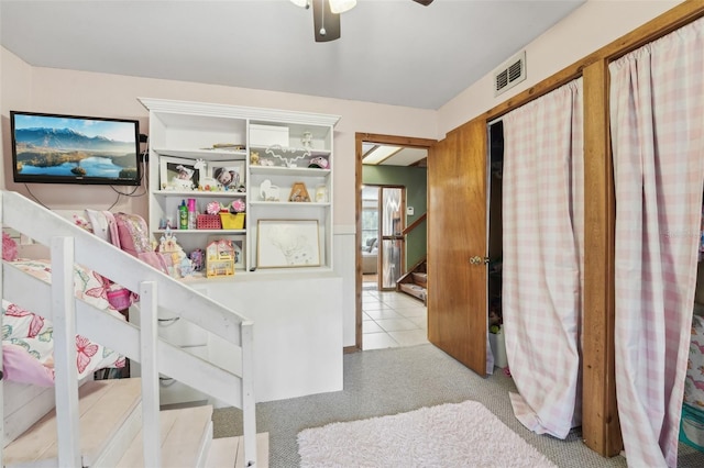 carpeted bedroom featuring ceiling fan