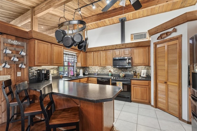 kitchen with wood ceiling, range, black dishwasher, kitchen peninsula, and backsplash