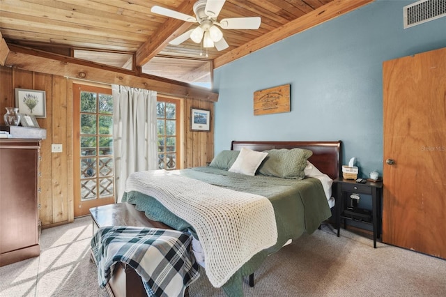 bedroom featuring wood walls, beamed ceiling, access to exterior, wood ceiling, and light carpet