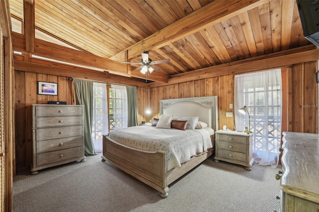 carpeted bedroom featuring wood walls, wood ceiling, access to outside, ceiling fan, and beam ceiling