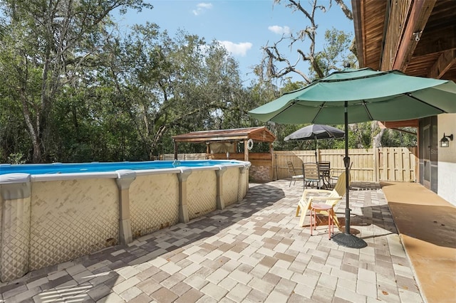 view of pool with a gazebo and a patio