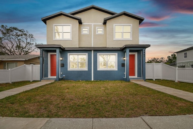 view of front of home featuring a lawn