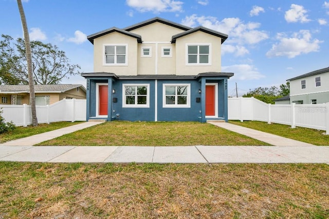 view of front of home with a front lawn