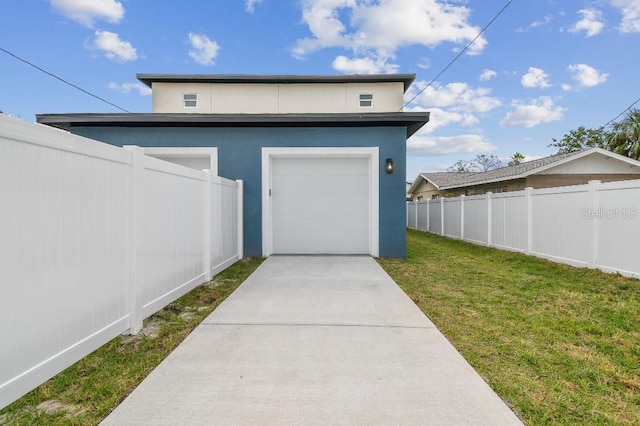 garage featuring a yard